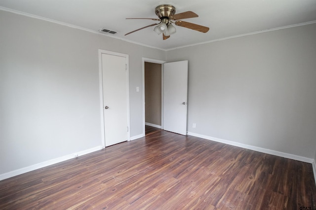 unfurnished room featuring crown molding, ceiling fan, and dark hardwood / wood-style floors