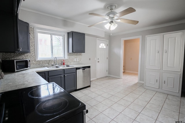 kitchen with sink, crown molding, gray cabinets, and stainless steel appliances