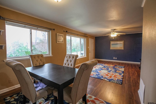 dining space featuring dark hardwood / wood-style flooring and ceiling fan