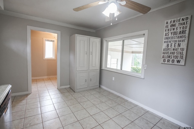 unfurnished bedroom featuring ornamental molding, multiple windows, and light tile patterned floors