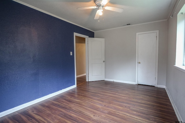 spare room with ornamental molding, dark hardwood / wood-style floors, and ceiling fan