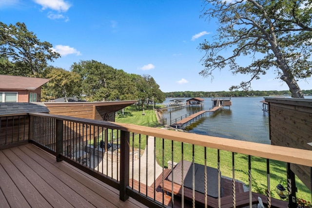 wooden terrace with a dock and a water view