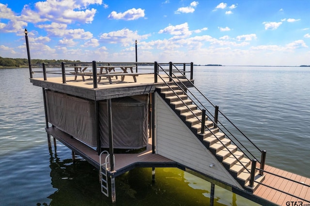 view of dock with stairs and a water view