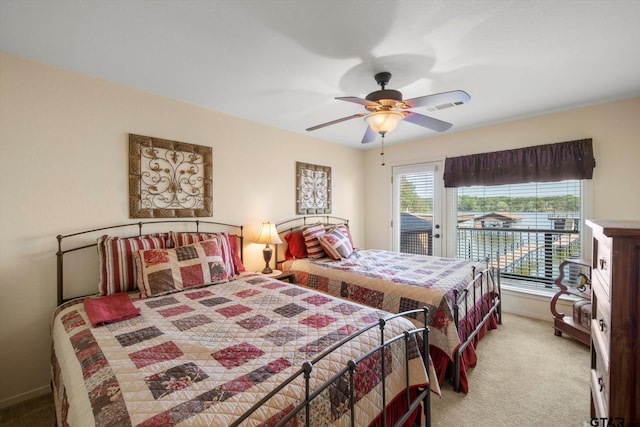 carpeted bedroom featuring ceiling fan, baseboards, and access to outside