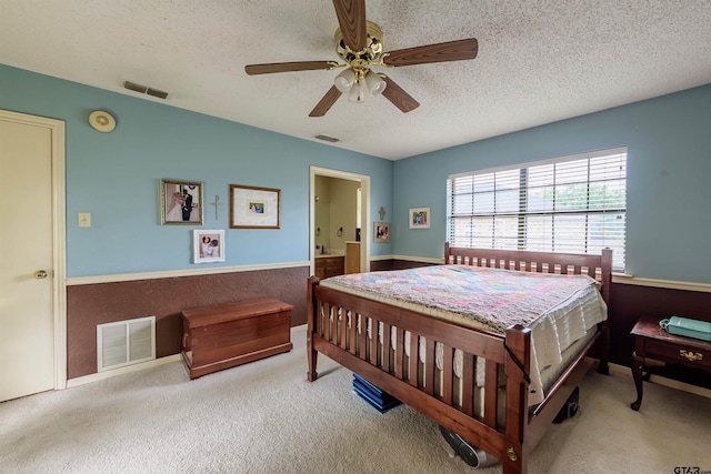 6001 Huntington Dr, Tyler, TX 75703 - bedroom featuring a textured ceiling, carpet, and ceiling fan