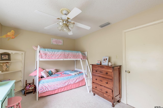 6001 Huntington Dr, Tyler, TX 75703 - carpeted bedroom featuring ceiling fan and a textured ceiling
