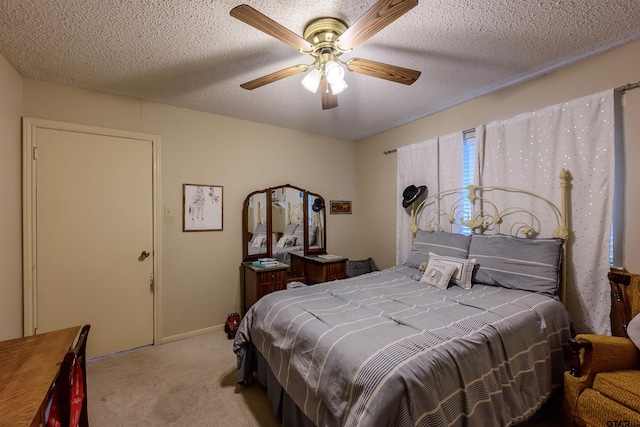 6001 Huntington Dr, Tyler, TX 75703 - carpeted bedroom featuring a ceiling fan and a textured ceiling