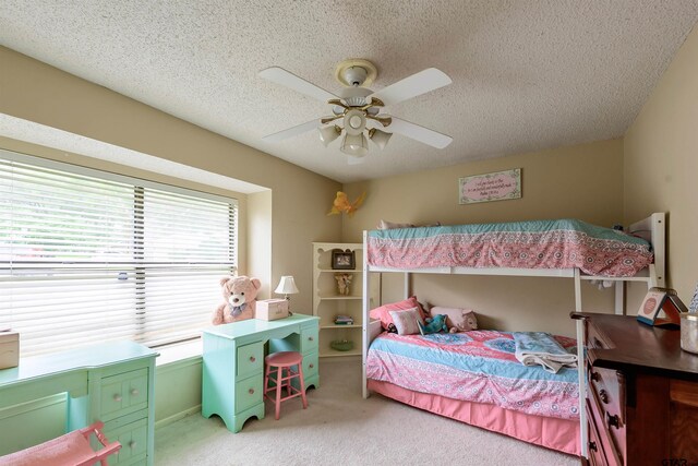 6001 Huntington Dr, Tyler, TX 75703 - bedroom with light colored carpet, a textured ceiling, and a ceiling fan