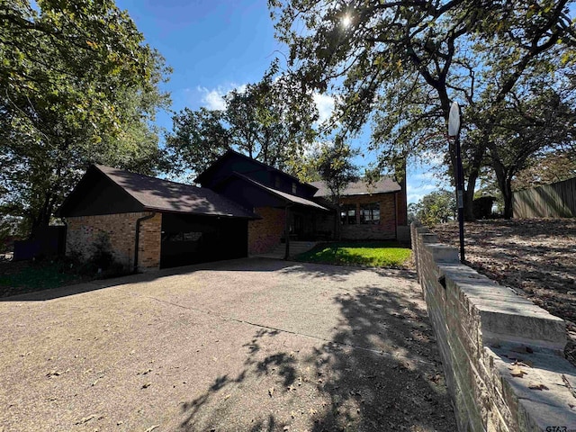 view of side of property with a garage