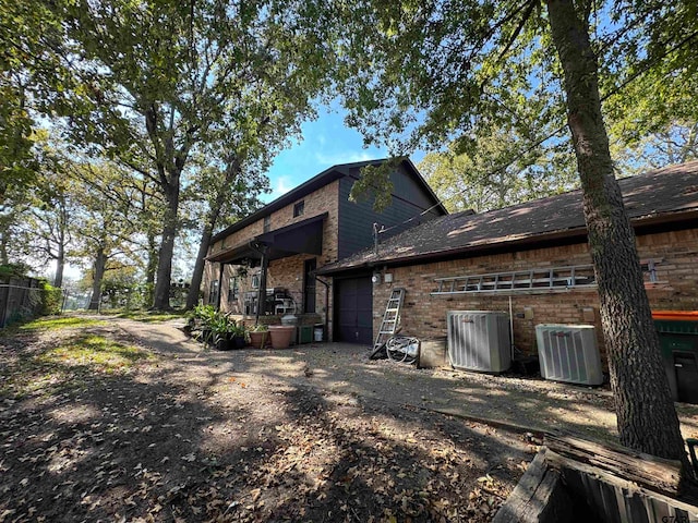 back of property featuring cooling unit