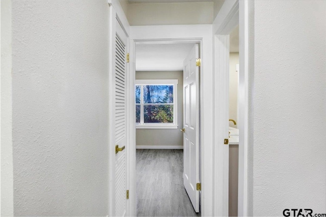 corridor featuring light wood-type flooring