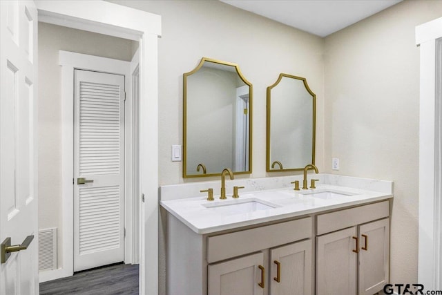 bathroom with vanity and hardwood / wood-style flooring