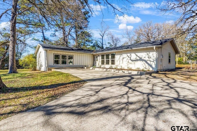 rear view of house with a lawn