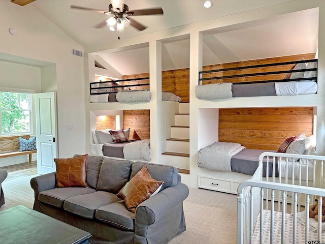 bedroom featuring vaulted ceiling, ceiling fan, carpet, and visible vents