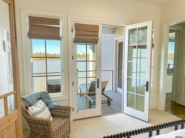 entryway featuring french doors and a water view