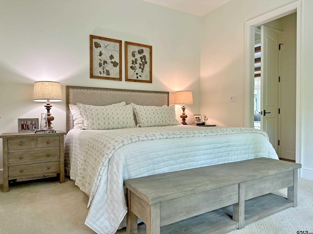 bedroom featuring light carpet