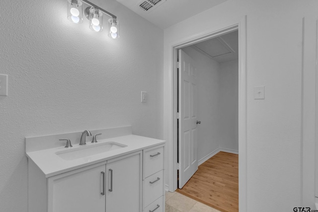 bathroom featuring visible vents, tile patterned flooring, and vanity