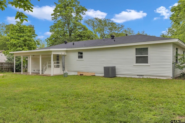 rear view of house with a yard, crawl space, fence, and a patio area