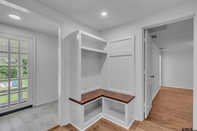 mudroom featuring baseboards, recessed lighting, and visible vents
