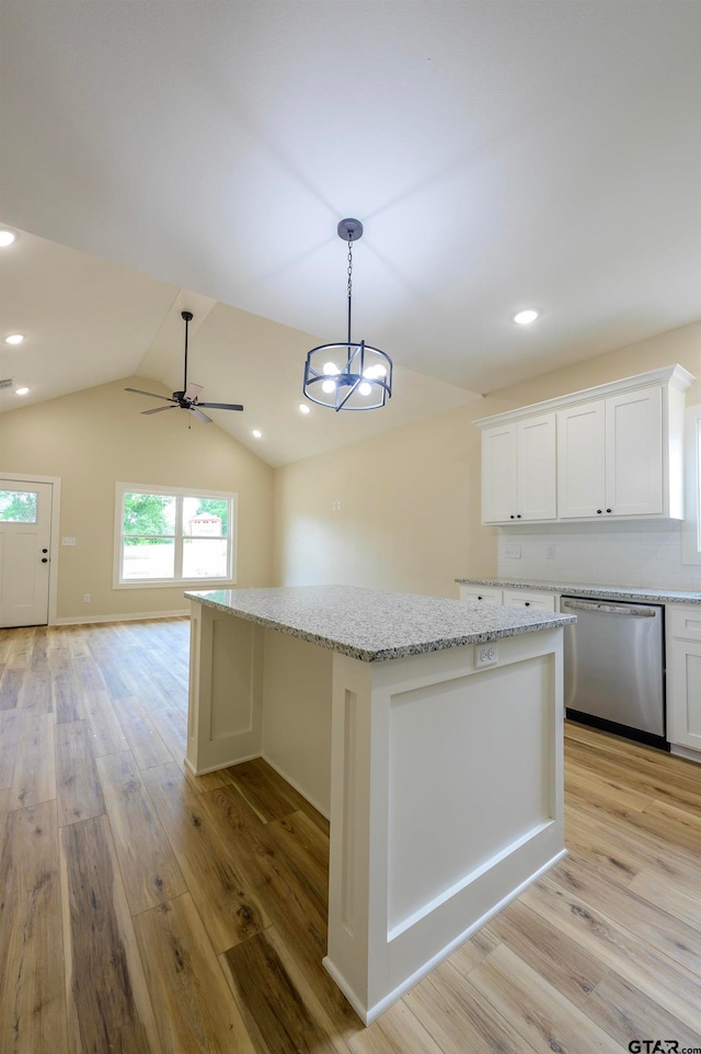 kitchen with white cabinetry, stainless steel dishwasher, light hardwood / wood-style floors, and a center island