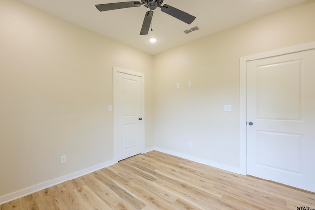 unfurnished room featuring ceiling fan and light wood-type flooring