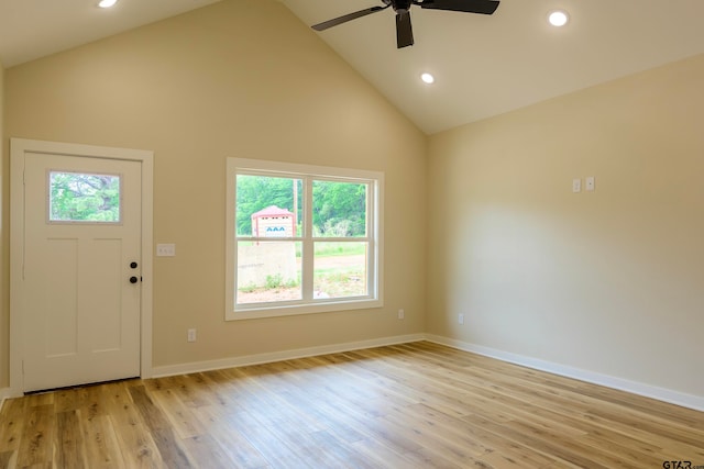 foyer entrance featuring high vaulted ceiling, plenty of natural light, light hardwood / wood-style floors, and ceiling fan