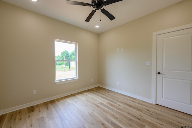 unfurnished room featuring ceiling fan and light wood-type flooring