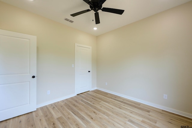 unfurnished room featuring light wood-type flooring and ceiling fan