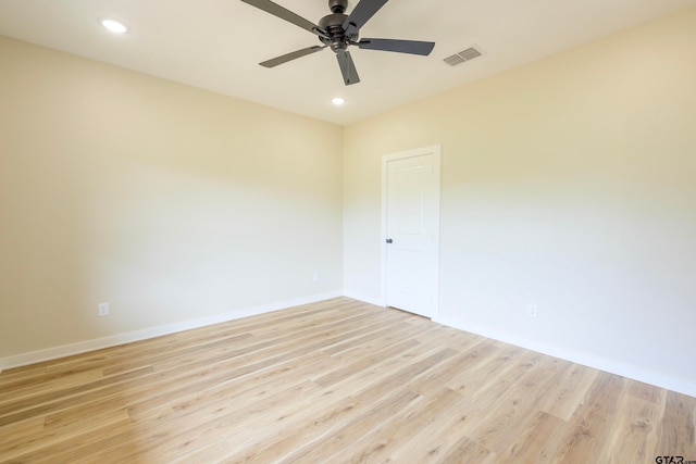 unfurnished room featuring ceiling fan and light hardwood / wood-style floors