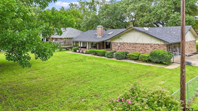 201 Karla Dr, Whitehouse, TX 75791 - single story home with brick siding, a chimney, an attached carport, roof with shingles, and a porch