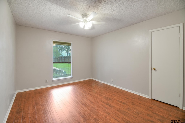 201 Karla Dr, Whitehouse, TX 75791 - spare room with wood finished floors, a ceiling fan, and a textured ceiling