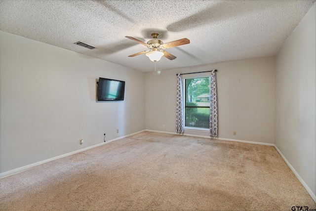201 Karla Dr, Whitehouse, TX 75791 - empty room featuring light colored carpet, ceiling fan, and a textured ceiling