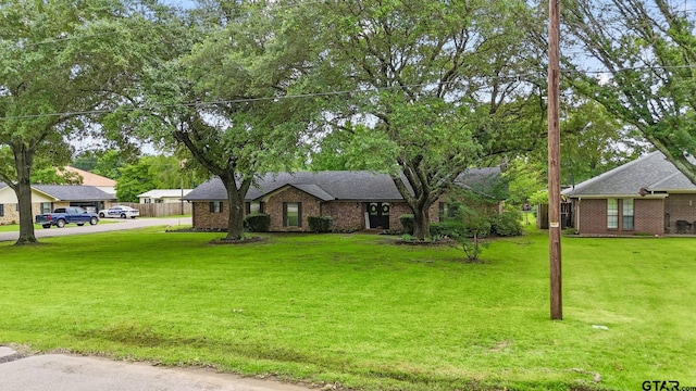 201 Karla Dr, Whitehouse, TX 75791 - view of front of house featuring a front lawn and brick siding