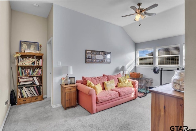 carpeted living room featuring baseboards, ceiling fan, and vaulted ceiling