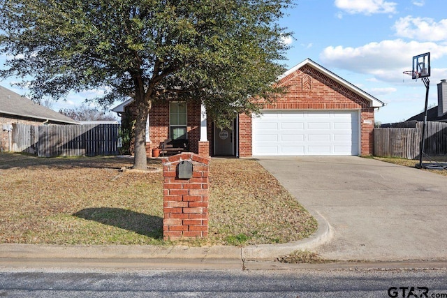 view of front of house with fence, driveway, an attached garage, a front lawn, and brick siding