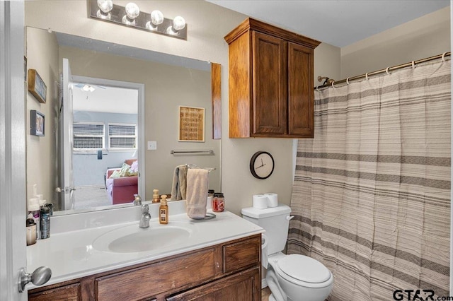 full bathroom featuring toilet and vanity