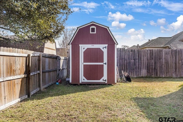 view of shed with a fenced backyard