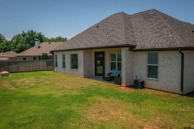 911 Charlie, Whitehouse, TX 75791 - back of house featuring roof with shingles, brick siding, central AC, and an outdoor hangout area
