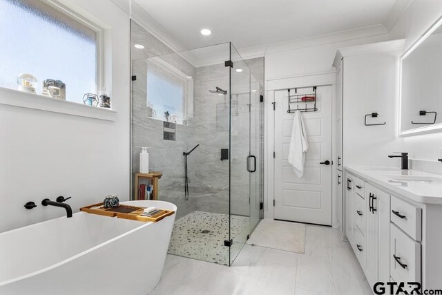 911 Charlie, Whitehouse, TX 75791 - bathroom featuring a freestanding tub, a stall shower, double vanity, marble finish floors, and recessed lighting