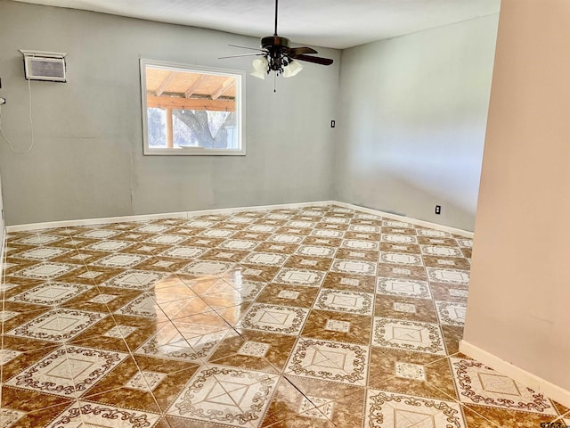 empty room with ceiling fan and a wall unit AC