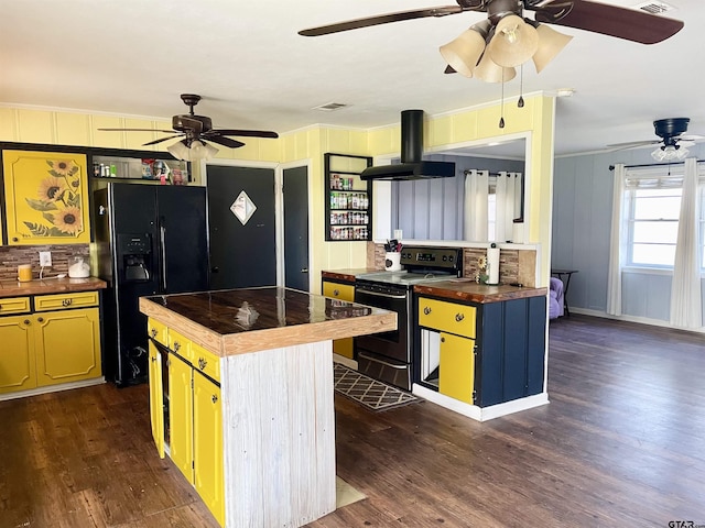 kitchen with a center island, island range hood, stainless steel range with electric stovetop, black fridge with ice dispenser, and butcher block countertops