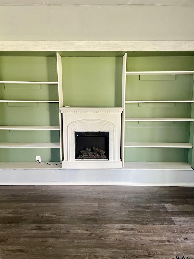 unfurnished living room with dark hardwood / wood-style floors