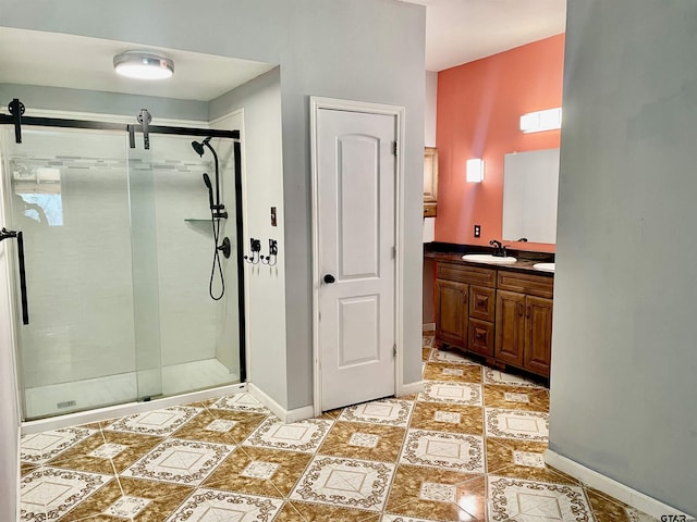 bathroom with a shower with door and vanity