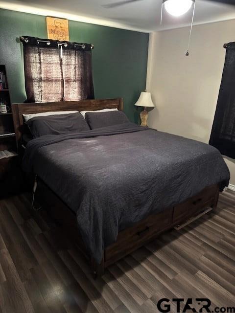 bedroom with wood finished floors