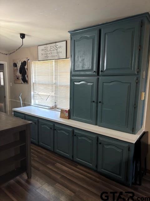 kitchen featuring dark wood-type flooring and light countertops