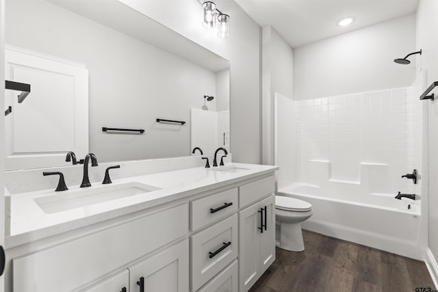 full bathroom with toilet, vanity, tub / shower combination, and hardwood / wood-style flooring