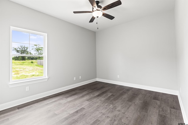 unfurnished room featuring ceiling fan and dark hardwood / wood-style floors