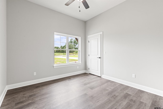 empty room featuring ceiling fan and hardwood / wood-style flooring