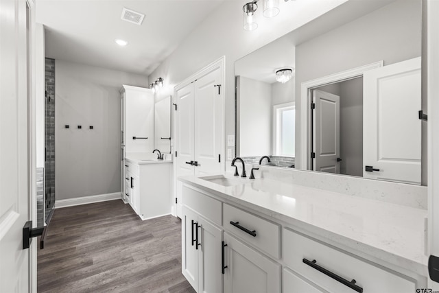 bathroom featuring vanity and hardwood / wood-style flooring