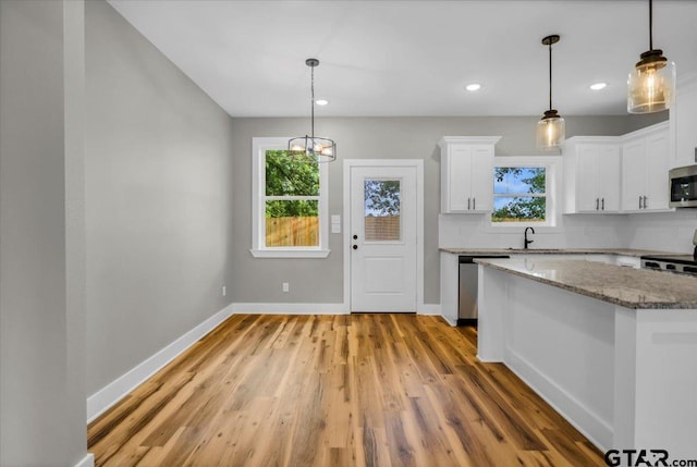 1002 E Main St, Whitehouse, TX 75791 - kitchen featuring stainless steel appliances, plenty of natural light, light wood-type flooring, baseboards, and recessed lighting